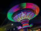 Colorful motion blur of spinning ride at a carnival. Art Print